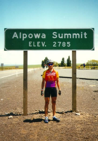 Standing below the sign for the Alpowa Summit.